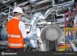 Engineer Using Laptop Computer For Maintenance In Thermal Power
